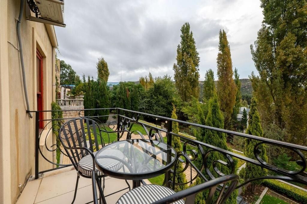 Deluxe Room, Balcony, City View | Outdoor dining | Breakfast, lunch, dinner and brunch served