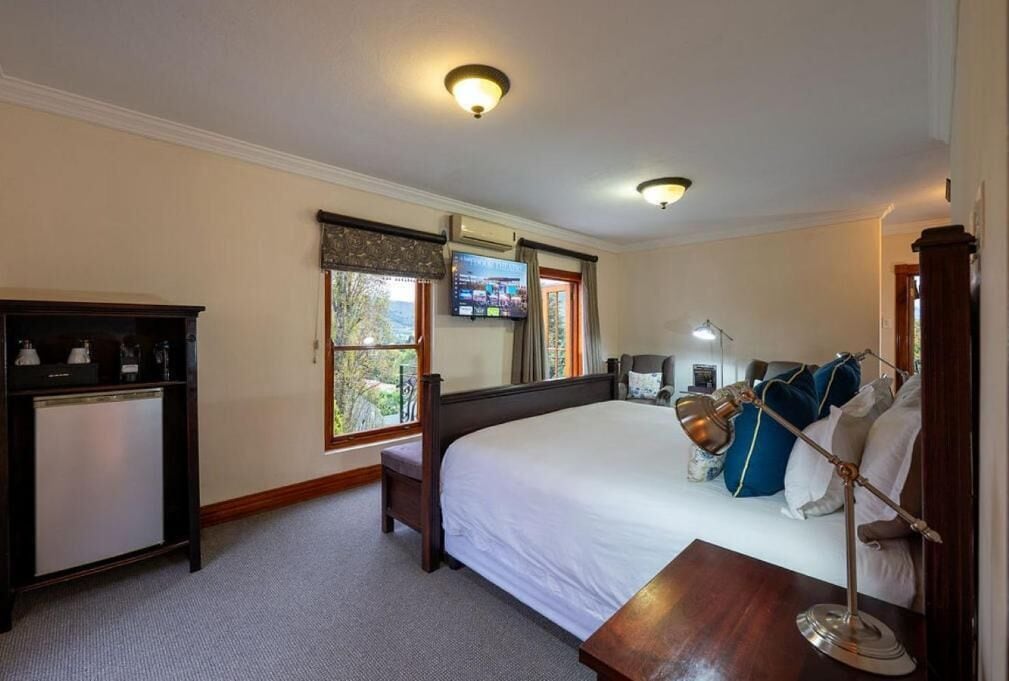 Deluxe Room, Balcony, City View | In-room safe, blackout drapes, soundproofing