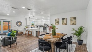 A modern kitchen with white cabinets, stainless steel appliances, and a central island. - Conveniently Located - S Lakeland Pool Home, Pet and Family Friendly (Lakeland)