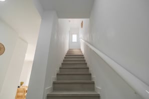 A staircase with a handrail, leading to a room with a window. - Vacation Apartment 'Isabel 6' with Private Terrace, Wi-Fi and Air Conditioning (Guargacho)