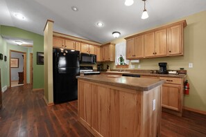 Private kitchen - Traverse City M-22 Cottage | Hot Tub, Beach Access (Traverse City)