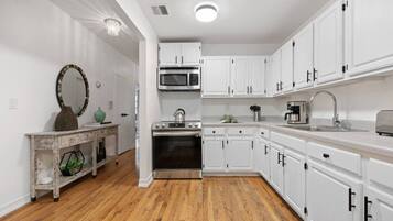Coffee/tea maker, fridge, microwave, oven