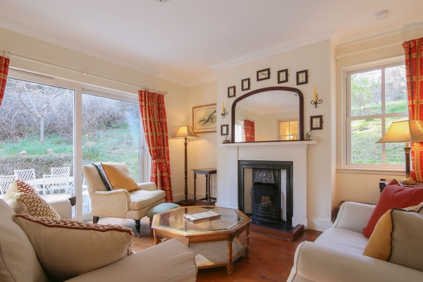 Enjoy natural light and refined comfort in this elegant living space.