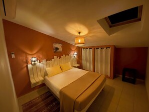 A bedroom with a bed, bedside lamps, a window, and a small stool. - A Little Provençal Paradise (Coccinelle Duplex) (Allemagne en Provence)
