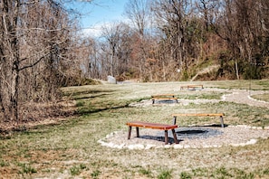 A park with benches and a clear path.