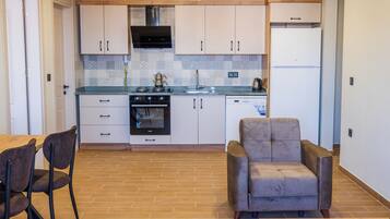Comfort Suite, Balcony, Sea View | Private kitchen | Full-size fridge, oven, stovetop, dishwasher