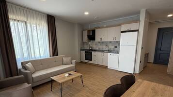 Comfort Apartment, Balcony, Sea View | Desk, laptop workspace, blackout drapes, iron/ironing board