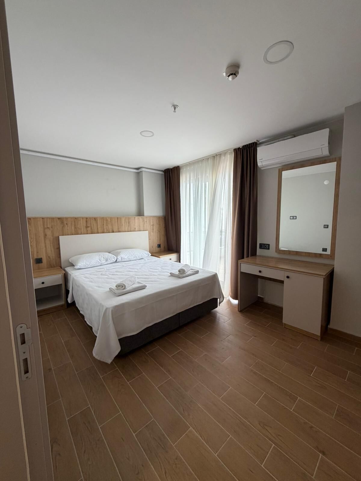 Apartment, Balcony, Sea View | Desk, laptop workspace, blackout drapes, iron/ironing board