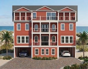 A multi-story building with a red exterior, two balconies, and a garage with two cars. - Brand New 10BR Oceanfront Home (Georgetown County)