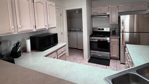 A kitchen with white cabinets, a stainless steel refrigerator, a microwave, an oven, and a dishwasher. - 3-bedroom house, great location. Shopping and dining nearby (El Paso)