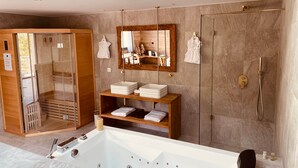 A modern bathroom with a large bathtub, a glass-enclosed shower, and a wooden vanity with a mirror. - Domaine Coul'Eau - Nordic Theme (Eaunes)
