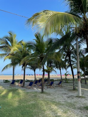A beach with palm trees, beach chairs, and umbrellas. - 🏖️MORROS 922 VACATION RENTAL, CARTAGENA DE INDIAS, COLOMBIA 🇨🇴🏝️ (La Boquilla)