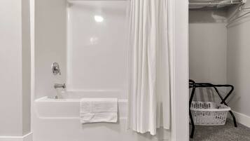 Shower, hair dryer, towels, shampoo