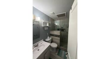 Shower, towels, soap, toilet paper