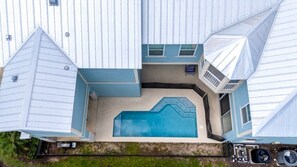 A large house with a swimming pool, multiple rooms, and a garage. - Beautiful &Relaxing 5BR Home w/Private Pool (62EW) (Kissimmee)