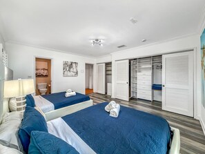 A hotel room with two beds, a bathroom, a closet, and a painting on the wall. - Heated Pool & Hot Tub! Pool Table+Close To Beach! (Fort Lauderdale)