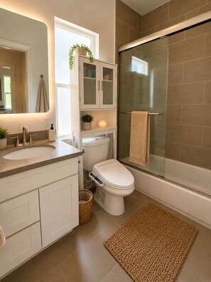 Shower, hair dryer, towels, soap