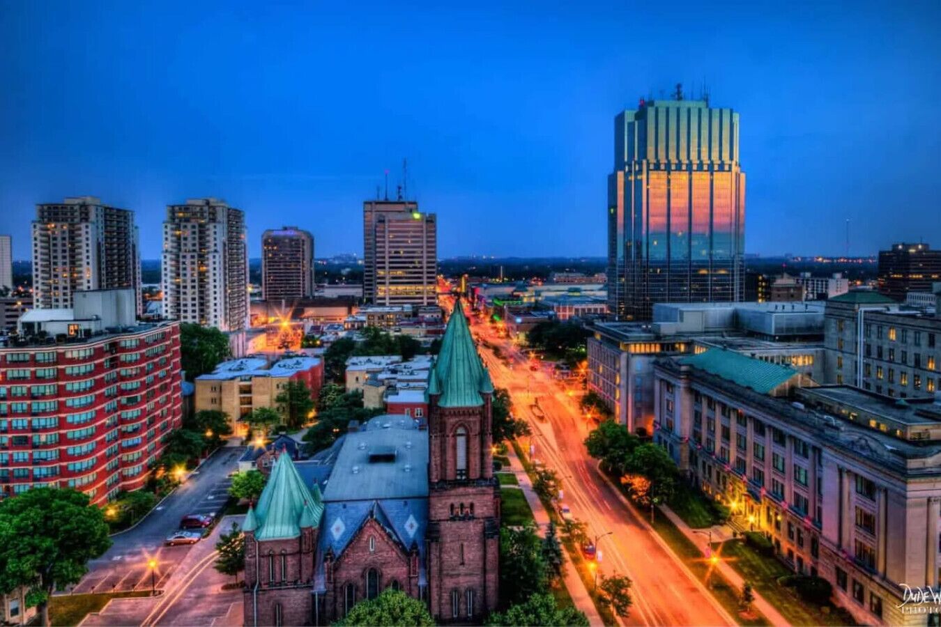A cityscape with a prominent church and modern buildings.