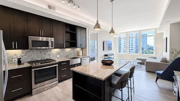 Luxury Apartment, 1 King Bed, Non Smoking, Kitchen | Private kitchen | Full-sized fridge, microwave, stovetop, dishwasher