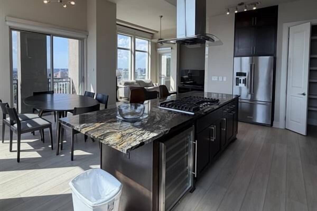 Penthouse | Desk, laptop workspace, blackout drapes, iron/ironing board