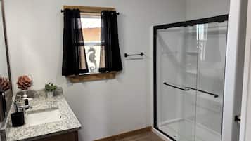 Shower, towels, soap, toilet paper