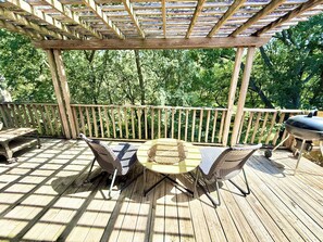 A wooden deck with a pergola, outdoor furniture, and a barbecue grill. - South Austin Sanctuary Location! Greenbelt, trifold, vaulted, pool, garage, pets (Austin)