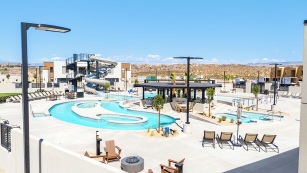 A resort pool area with a lazy river, lounge chairs, and a covered seating area. - Isle B there 4U- Private Hot Tub|ResortPool|GolfCourse|Sleeps20 Mins to Canyon (Washington)
