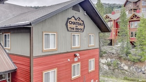 A multi-story building with a sign reading "Chateau on the Ridge." - Chateau on the Ridge by Okanagan Premier (Beaverdell)