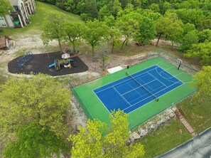 An aerial view of a park with a basketball court and playground equipment. - Condo Mins to Silver Dollar City w Free Tickets_Outdoor Pool_Tennis Courts_Water Path (Branson)