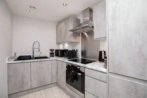 Coffee/tea maker, microwave, dishwasher, dining table - Luxury 2 Bed Apt at Victoria Riverside | Parking (Leeds)