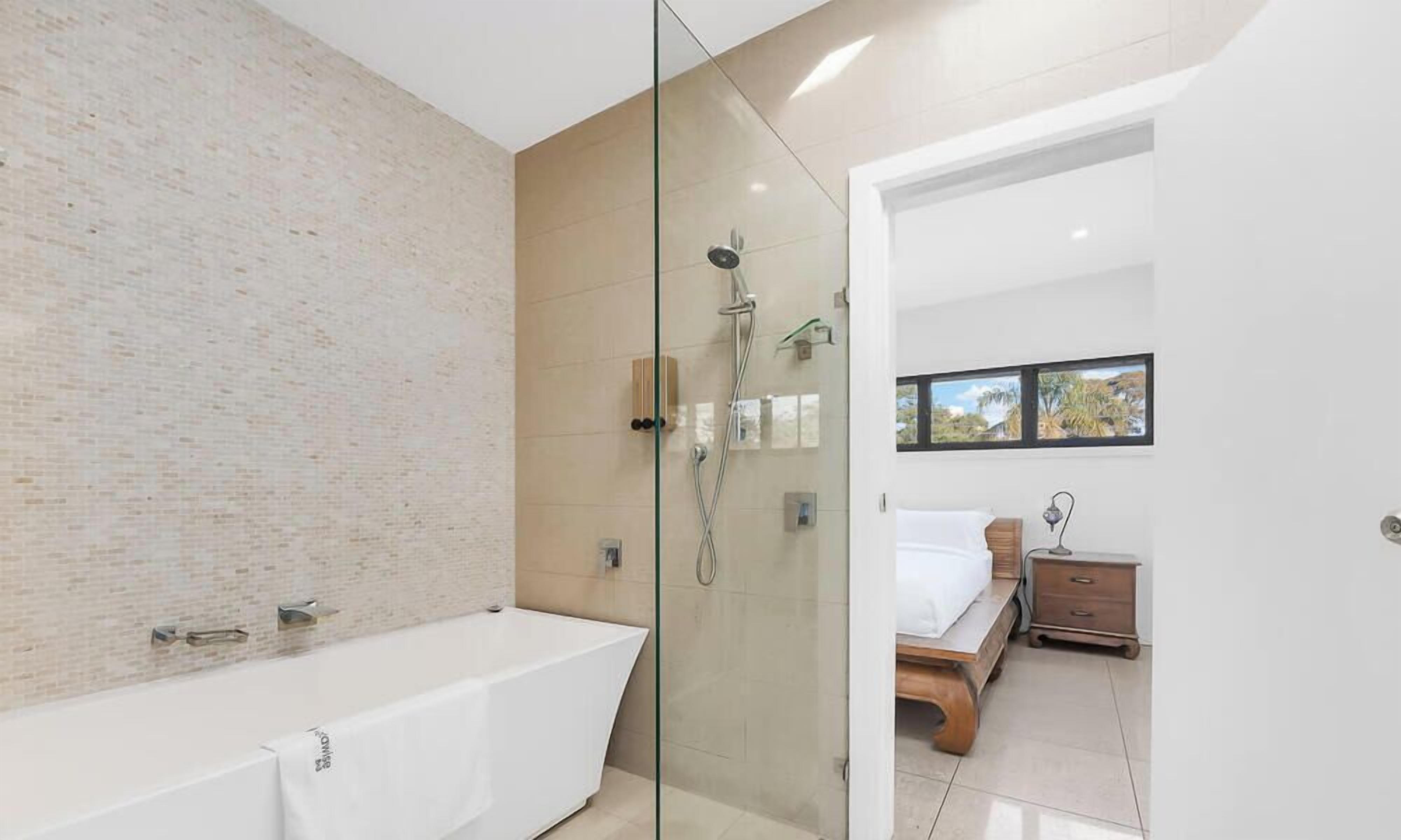 Shower, hair dryer, towels, shampoo