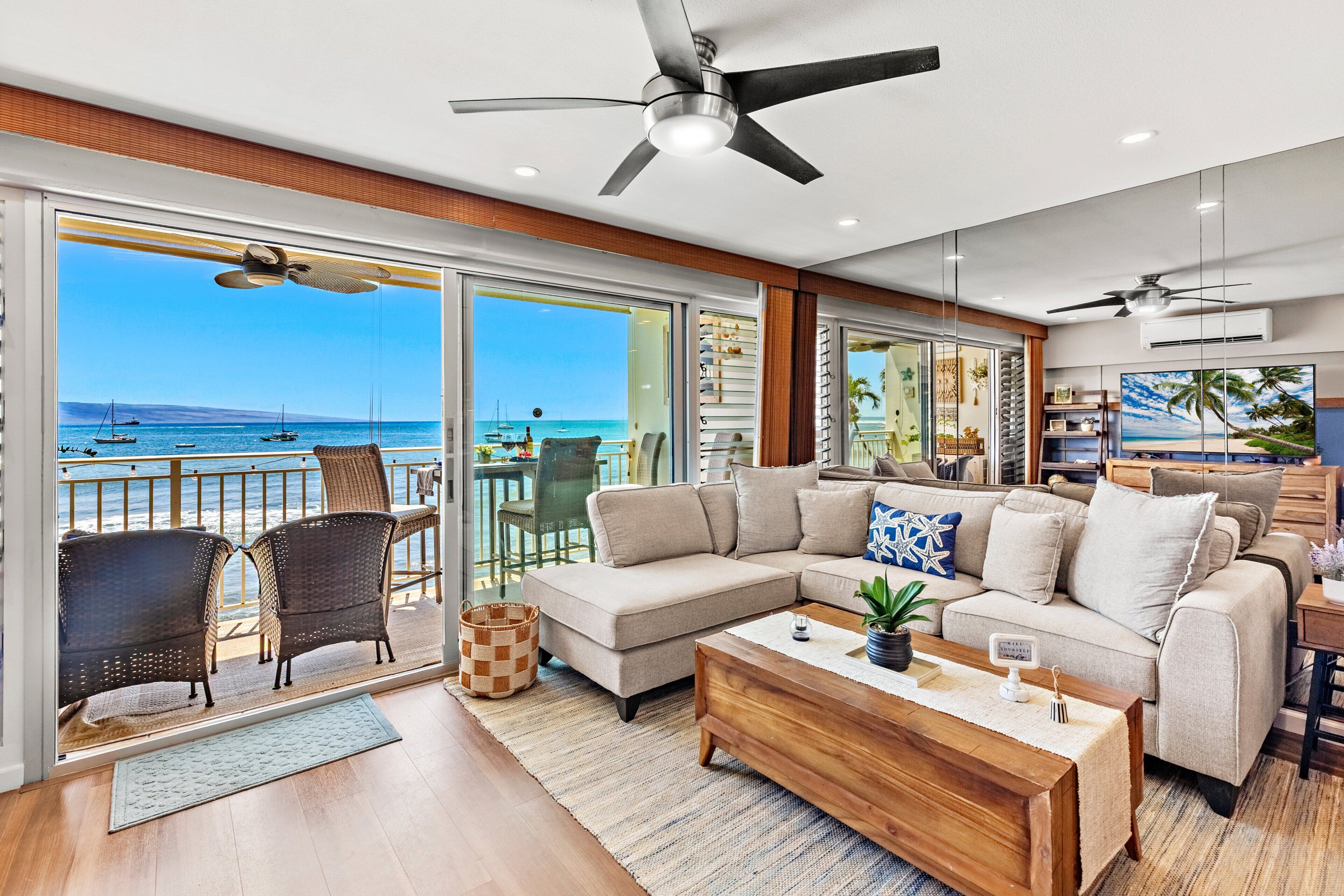 Bright oceanfront living room with breathtaking panoramic Pacific views.