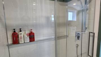 Shower, hair dryer, towels, soap