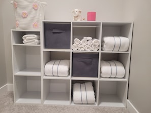 A storage unit with multiple compartments, some with handles, and a decorative item on top. - FULL HOUSE (3 beds)-A place fully feel like home (Regina)