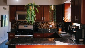 Coffee/tea maker, fridge, microwave, oven