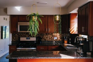 Coffee/tea maker, fridge, microwave, oven