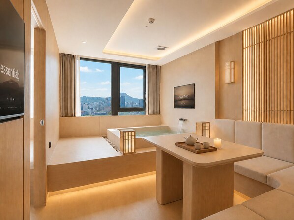 A modern hotel room with a large window, a bathtub, a sofa, and a television. - UH Continental SeoulCenter (Seoul)