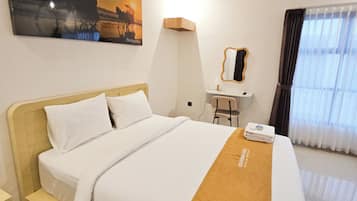 Deluxe Studio, Patio, Pool View | In-room safe, desk, laptop workspace, blackout curtains