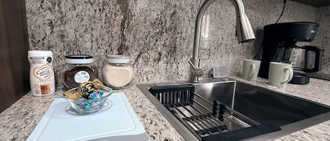 Coffee/tea maker, microwave, stovetop, cookware/dishes/utensils