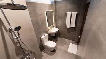 Shower, slippers, towels, soap