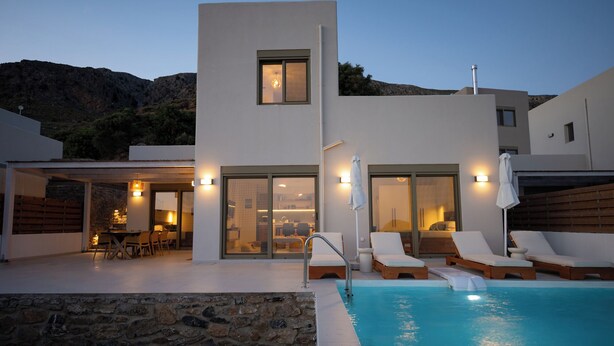 A modern villa with a swimming pool, outdoor seating, and a dining area. - Hillside Villa with Private Pool & Panoramic Views | Plakias & Preveli (Asomatos)