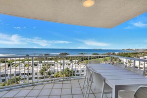 A balcony with a view of the ocean and a residential area. - Amazing Ocean Views from Unit 87-Catalina-II (Maroochydore)