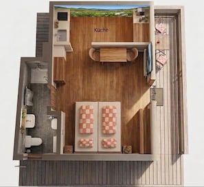 Eine kompakte Küche mit Essbereich, ein kleines Badezimmer und ein Balkon mit Sitzgelegenheit.
