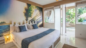 A bedroom with a large bed, a view of the outdoors, and a painting on the wall. - Kima Surf Camp Bali Seminyak (Seminyak)