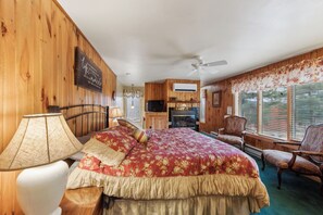 A bedroom with a bed, a chair, a desk, a ceiling fan, and a window with blinds. - 2 Homes | Heated Pool + Game Room + Sauna | Mins to Gore Mountain (North Creek)