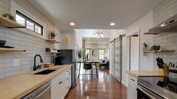 A modern kitchen with wooden countertops, stainless steel appliances, and a central island. - Extended East Knoxville Stay, 2 Mi to Dtwn! (Knoxville)
