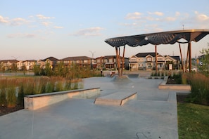 A skate park with concrete ramps and a large metal shelter. - Lovely Guest Suite in Calgary (Calgary)