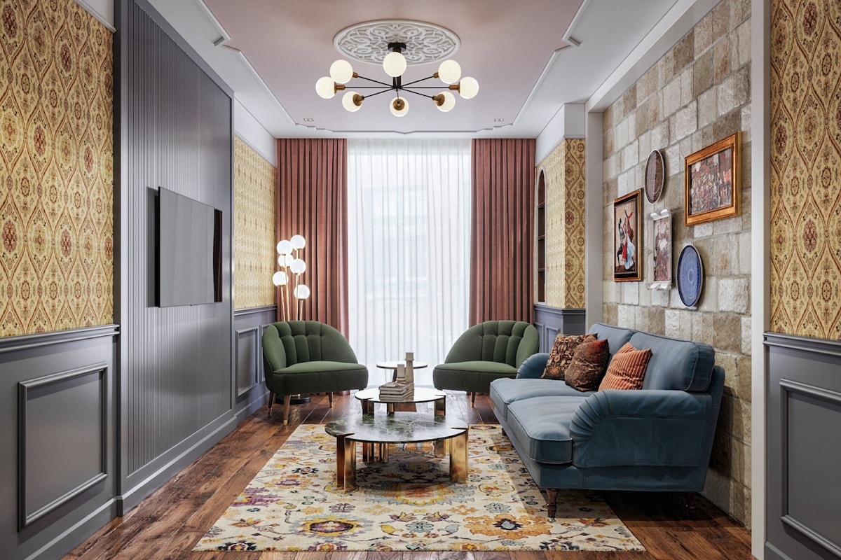 Une pièce avec un papier peint à motifs, un fauteuil vert, un canapé bleu, une table basse ronde et un tapis à motifs.