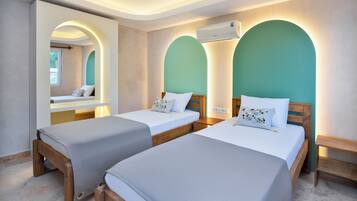 Family Double or Twin Room, Sea View | Minibar, in-room safe, desk, laptop workspace