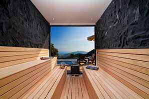A sauna with wooden benches and a view of mountains. - Turquoise Retreat Wellness & Spa (Kaş)